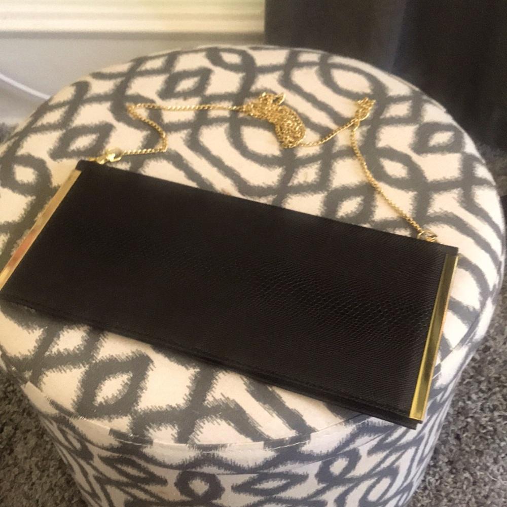 Faux snakeskin brown clutch